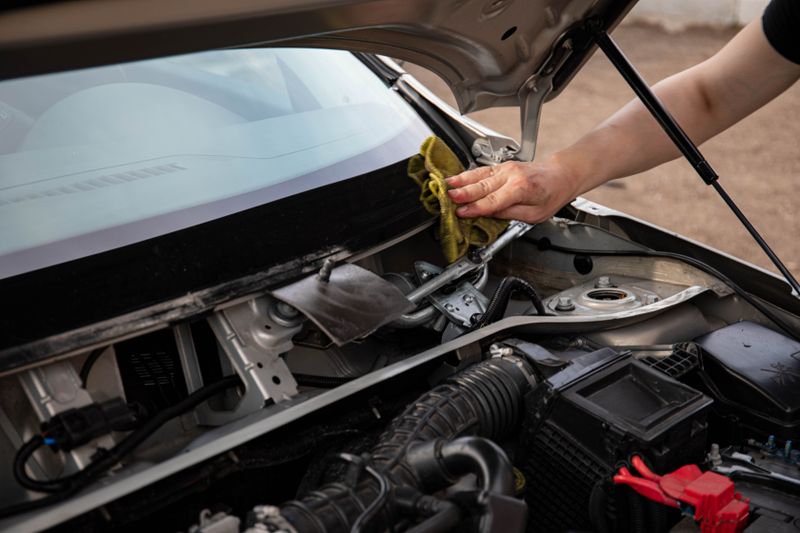Windshield rock chip being repaired with resin